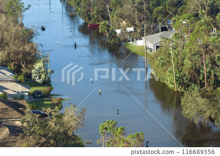 Flooded houses by hurricane rainfall in Florida residential area. Consequences of natural disaster 116689356