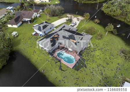 Flooded houses by hurricane Ian rainfall in Florida residential area. Consequences of natural disaster 116689358