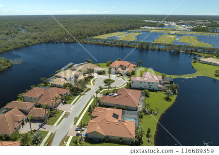 Flooded houses by hurricane Ian rainfall in Florida residential area. Consequences of natural disaster Flooded houses by hurricane Ian rainfall in Florida residential area. Consequences of natural disaster 116689359