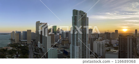 Evening urban landscape of downtown district of Miami Brickell in Florida, USA. Skyline with high skyscraper buildings in modern American megapolis Evening urban landscape of downtown district of Miami Brickell in Florida, USA. Skyline with high skyscraper buildings in modern American megapolis 116689368
