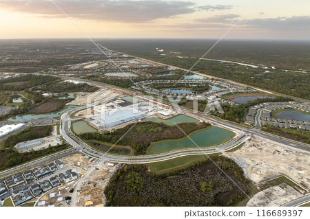 Development of residential housing in the USA. Wooden frames of new cheap American homes under construction 116689397