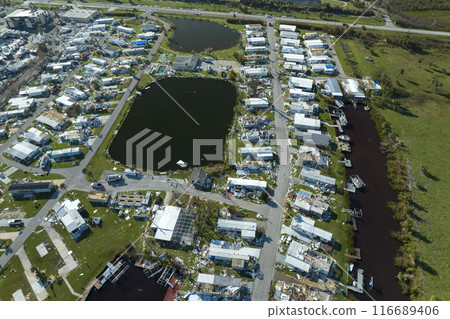 Destroyed by hurricane Ian suburban houses in Florida mobile home residential area. Consequences of natural disaster Destroyed by hurricane Ian suburban houses in Florida mobile home residential area. Consequences of natural disaster 116689406