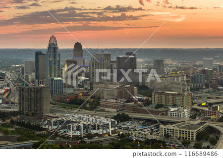 Cincinnati Ohio urban architecture in city downtown at sunset. Panoramic view of business district skyline with high-rise buildings at nightfall 116689486