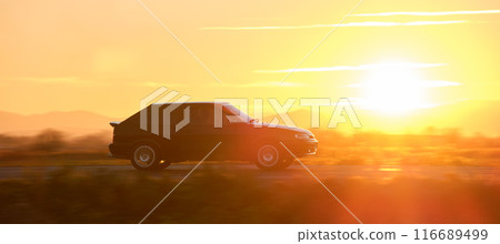 Car driving fast on intercity road at sunset. Highway traffic in evening Car driving fast on intercity road at sunset. Highway traffic in evening 116689499