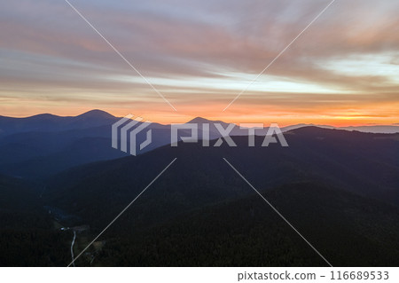 Beautiful mountain panoramic landscape with hazy peaks and foggy valley at sunset 116689533