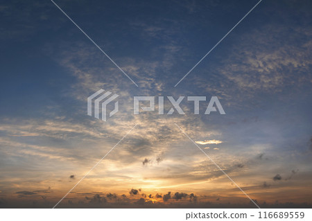 Amazing sunset skyscape. Evening sky with bright colorful orange and yellow clouds 116689559