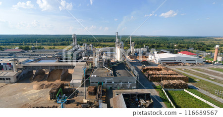 Aerial view of wood processing factory with stacks of lumber at plant manufacturing yard. 116689567