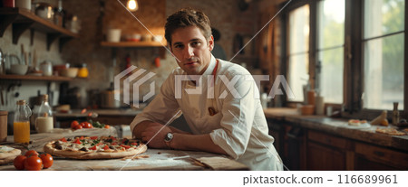 Italian male pizza chef in chef's clothes and apron in the kitchen preparing pizza Italian male pizza chef in chef's clothes and apron in the kitchen preparing pizza 116689961
