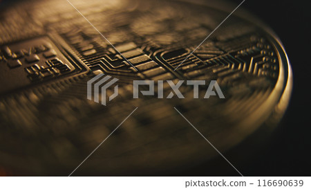 Close up of spinning golden bitcoin coin virtual money 116690639