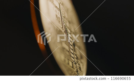 Close up of spinning golden bitcoin coin. BTC logo 116690655