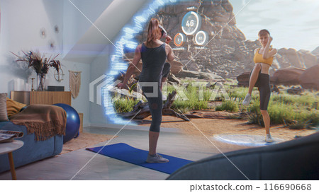 Athletic woman wears on AR headset and exercises doing squats Athletic woman wears on AR headset and exercises doing squats 116690668
