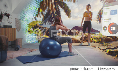 Female athlete trains with fitball. VR screen shows virtual coach and interface of AR fitness app Female athlete trains with fitball. VR screen shows virtual coach and interface of AR fitness app 116690679
