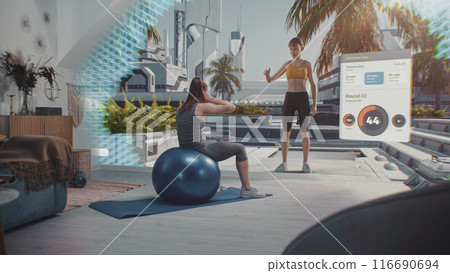 Female athlete exercises with fitball. VR screen with virtual coach and interface of AR fitness app 116690694