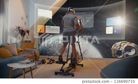 African American athlete training on orbitrek. Virtual screen with AR workout app African American athlete training on orbitrek. Virtual screen with AR workout app 116690710