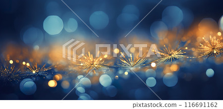 Cozy Christmas golden snowflakes on the snow background with yellow and blue bokeh hues. Festive, uplifting wallpaper backdrop 116691162
