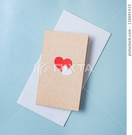 Love letter postcard with a red heart on a red and blue background. Concept of Valentine's day 116691413