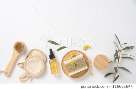 Flat lay beauty spa with natural cosmetic products peeling natural soap, sponges, oil Flat lay beauty spa with natural cosmetic products peeling natural soap, sponges, oil 116691644
