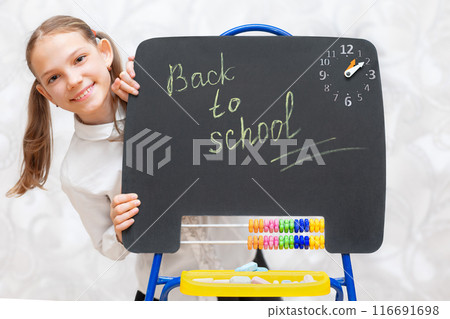 Girl with chalkboard back to school Girl with chalkboard back to school 116691698