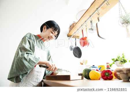 Woman cooking in the kitchen Woman cooking in the kitchen 116692881