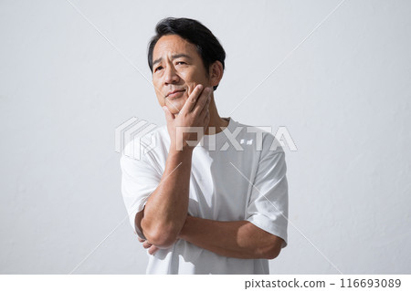 Senior man with hand on chin, image of beauty and skin care in his 50s Senior man with hand on chin, image of beauty and skin care in his 50s 116693089