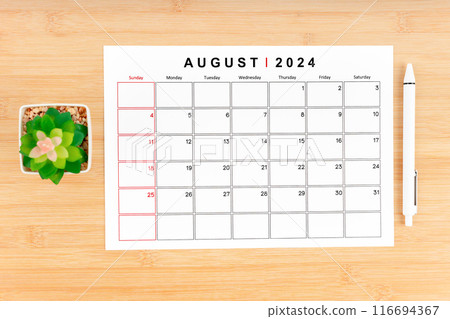 August 2024 calendar page and houseplant on wooden background. August 2024 calendar page and houseplant on wooden background. 116694367