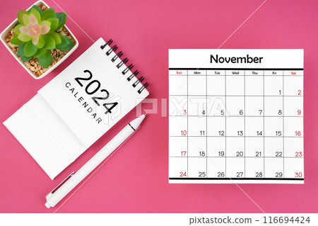 White calendar for November 2024 and pen on pink color background. White calendar for November 2024 and pen on pink color background. 116694424