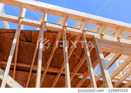 Wooden frame beam is used for framing during construction of new home 116695026