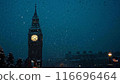 Clock tower on a snowy night 116696464