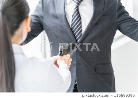 A female high school student points a gun at a man (assault, self-defense, crime, intimidation, mass shooting) A female high school student points a gun at a man (assault, self-defense, crime, intimidation, mass shooting) 116699396