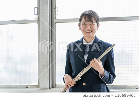 Asian high school girl practicing flute in school extracurricular activity 116699405