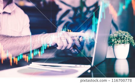 Businessman typing on laptop in office with double exposure of financial graph. 116700778