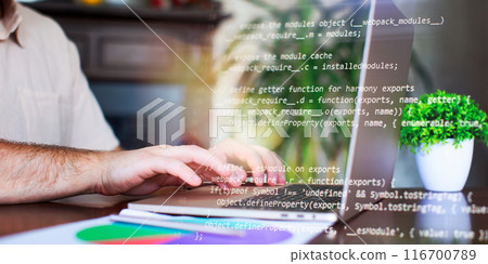 Programmer working with a computer in the office. Close-up of a man's hands typing on a keyboard. Programmer working with a computer in the office. Close-up of a man's hands typing on a keyboard. 116700789