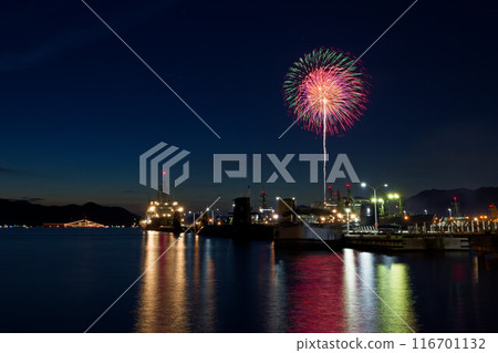 Summer festival in Kure, fireworks display on the sea, light green, yellow, pink Summer festival in Kure, fireworks display on the sea, light green, yellow, pink 116701132