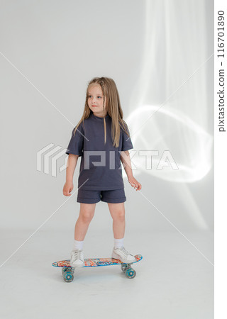 Little cute child kid baby girl 4-5 years old wearing light denim clothes isolated on wall background, children studio portrait. Mother's Day, love family, parenthood childhood concept 116701890