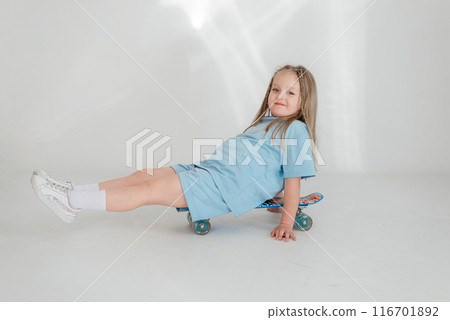 Little cute child kid baby girl 4-5 years old wearing light denim clothes isolated on wall background, children studio portrait. Mother's Day, love family, parenthood childhood concept Little cute child kid baby girl 4-5 years old wearing light denim clothes isolated on wall background, children studio portrait. Mother's Day, love family, parenthood childhood concept 116701892