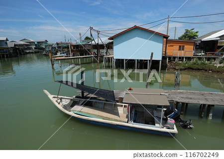 Village and boats on Ketam Island, Malaysia 116702249