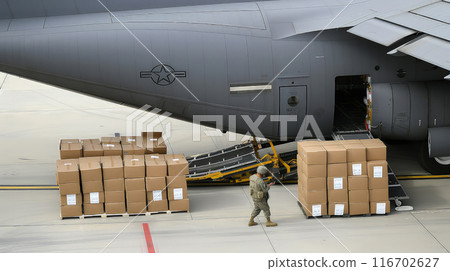 Packing military cargo at a military air base for shipment. Packing military cargo at a military air base for shipment. 116702627