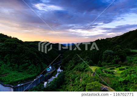 Evening view of Nunome Dam in the summer of 2024: A dynamic sunset spreading across the northern sky of the downstream Nunome River ② Evening view of Nunome Dam in the summer of 2024: A dynamic sunset spreading across the northern sky of the downstream Nunome River ② 116702771