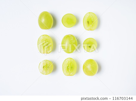 Creative flat lay made of  green grapes  on white background. Top view and copy space 116703144