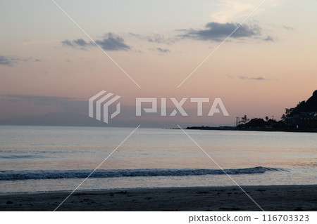 sun setting into the sea 116703323