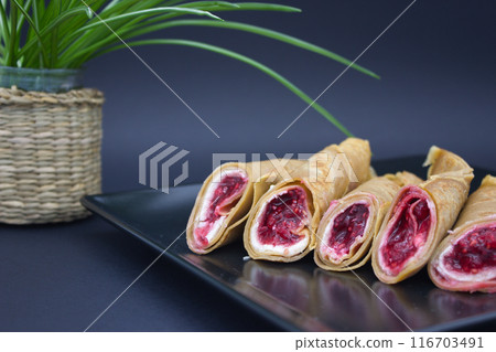 Stylish Dessert Crepes with Berry Filling 116703491