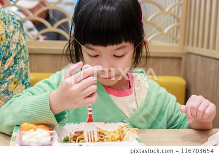 Cute little asian child girl eating food 116703654