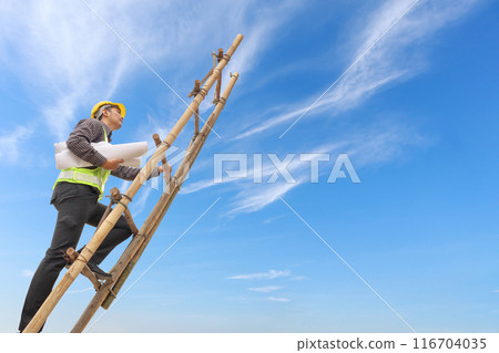 Asian business man engineer climbing up ladder with blue sky, career growth and success concept Asian business man engineer climbing up ladder with blue sky, career growth and success concept 116704035