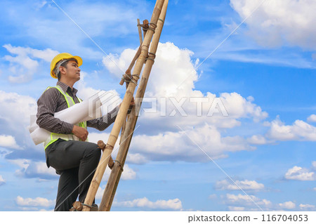 Asian business man engineer climbing up ladder with blue sky, career growth and success concept 116704053