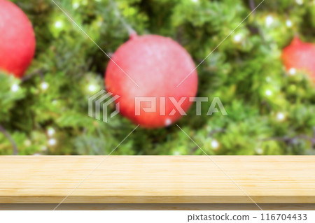 Empty wood table top with blur Christmas tree with bokeh light background Empty wood table top with blur Christmas tree with bokeh light background 116704433