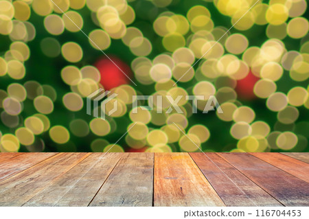 Empty wood table top with blur Christmas tree with bokeh light background Empty wood table top with blur Christmas tree with bokeh light background 116704453