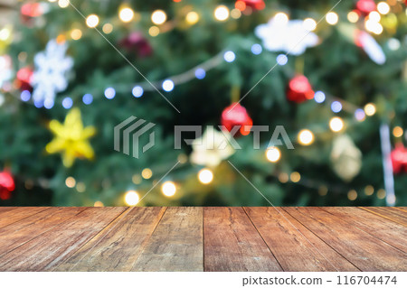 Empty wood table top with blur Christmas tree with bokeh light background 116704474