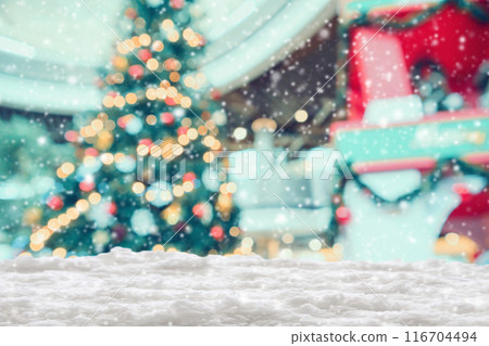 Empty white snow with blur Christmas tree with bokeh light background 116704494
