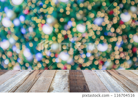 Empty wood table top with blur Christmas tree with bokeh light background 116704516