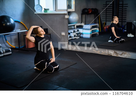 Young attractive sportive woman wearing activewear doing exercises at GYM, Young attractive sportive woman wearing activewear doing exercises at GYM, 116704610
